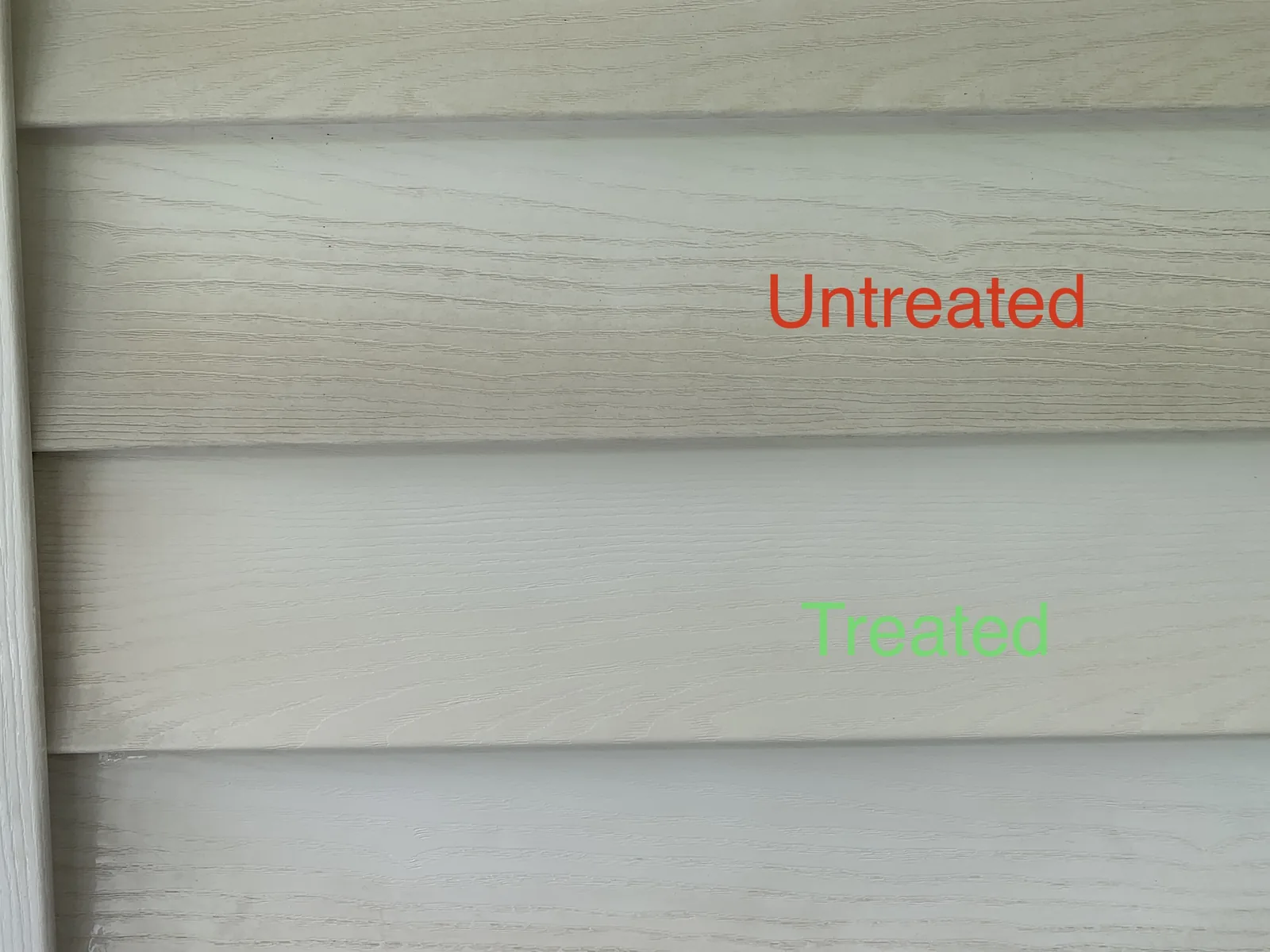 Side-by-side comparison of untreated and soft-washed vinyl siding on a Louisville home